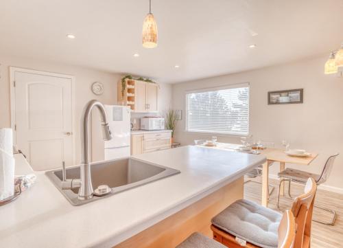 a kitchen with a sink and a counter top at Sandy Feet in Nehalem