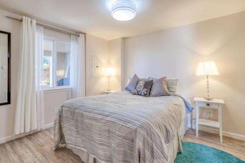 a bedroom with a bed and a window at Sandy Feet in Nehalem