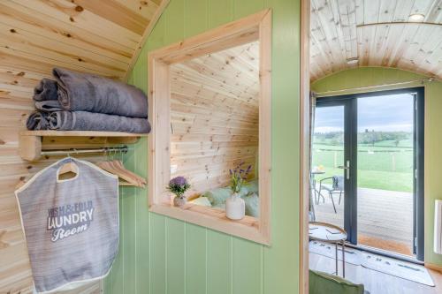 a tiny house with a window and a patio at 1 Bed in Blairdrummond oc-b37875 in Doune