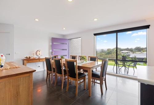 a kitchen and dining room with a table and chairs at Marlin Vista - Pet Friendly in Eden