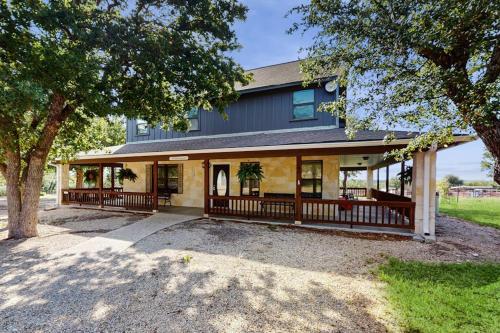 an exterior view of a house with a porch at Idyllic Home with Firepit, Gazebo, Patio, & Amazing Deck Views - Dog-Friendly in Fredericksburg