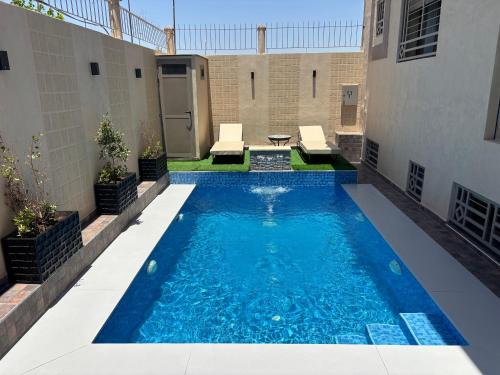 a swimming pool in the middle of a building at Villa Sara, Piscine et Jardin privée in Marrakesh