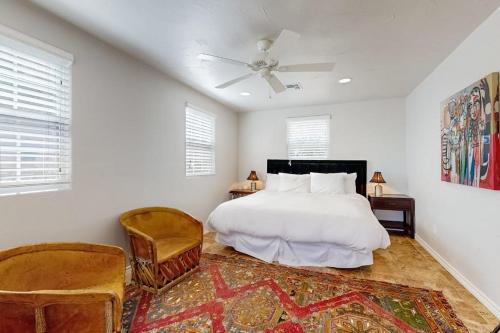 a bedroom with a bed and a ceiling fan at 4-Bedroom Spacious Home with Guest House & Pool, Located on 9 Acres of Land in Spicewood