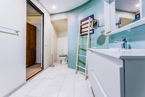 a bathroom with a sink and a toilet at Fare Aute Beach in Vaianae