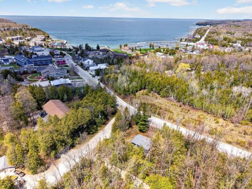 an aerial view of a small town next to the ocean at Maevebrook in Sister Bay