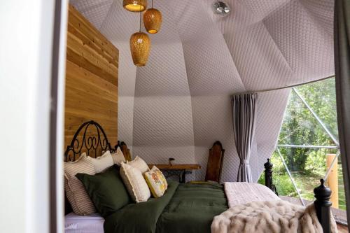 a bedroom with a bed in a tent at Woodland Creek in Chase