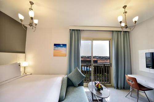 Postel nebo postele na pokoji v ubytování Jannah Hotel Apartments & Villas