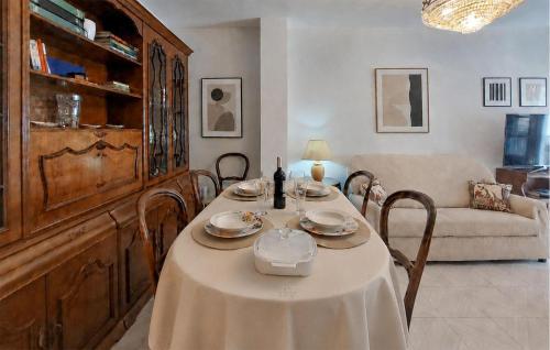 a dining room with a table and a couch at Casa Del Arco in Ronda