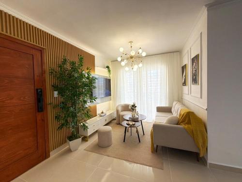 a living room with a couch and a table at Comfort Home in La Cana