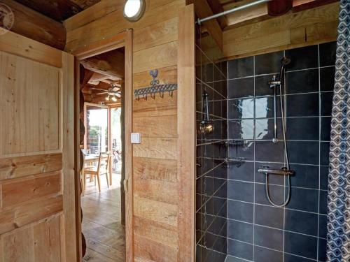 a bathroom with a walk in shower next to a door at Chalet chaud, nature sauvage, internet PC, idéal randonnées - FR-1-496-184 in Saint-Martin-la-Sauveté