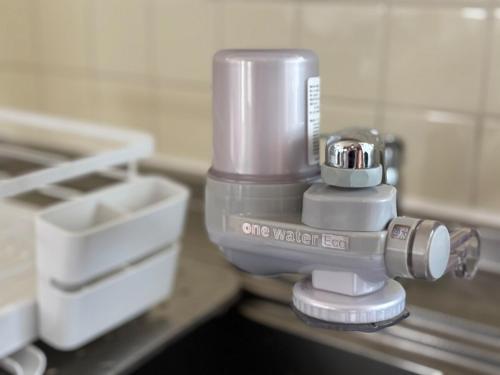 a food processor sitting on a counter in a kitchen at Rela More in Ginowan