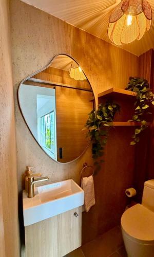 a bathroom with a sink and a mirror at Villa Divina in Punta Cana