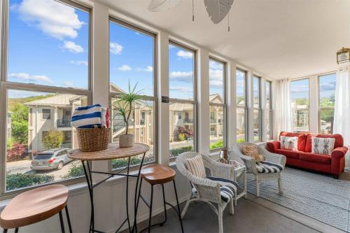 a living room with a lot of windows at Emerald Bay Escape with Sunroom in Hollister