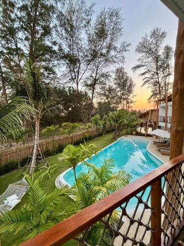 a view of a swimming pool from a balcony at The TALAY in Ban Na Tai