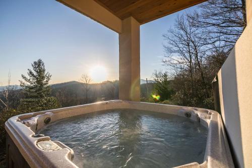 a jacuzzi tub in the backyard of a house at Alpine Vista in Lenoir