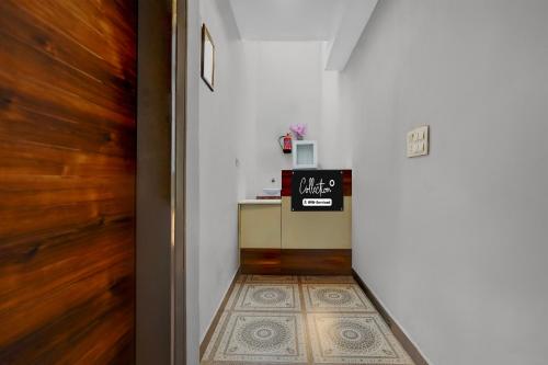 a hallway with a door leading into a room at Collection O Kharar Bus Terminal Formerly Hotel Kamboj in Kharar