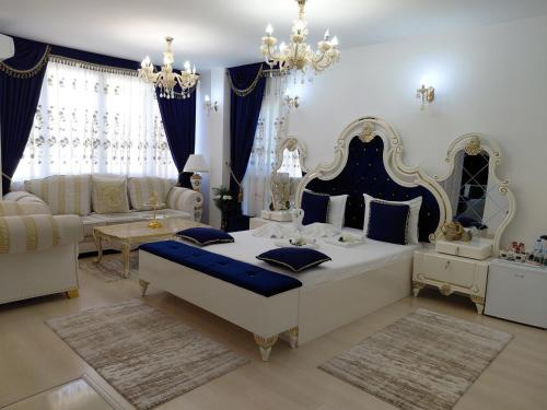 a living room with a bed and a couch at Hotel Dalia - Bankya in Bankya