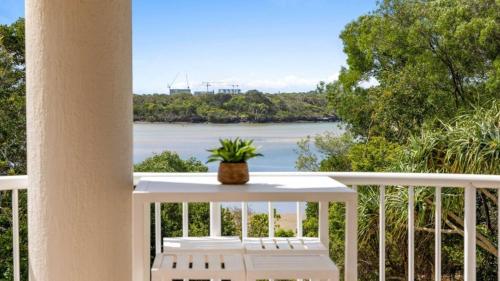 a balcony with a view of the water at The Entrance Unit 5 in Kawana Waters