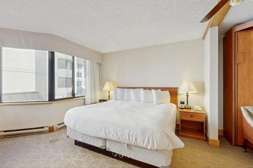 a hotel room with a large bed and a window at GL306 Butte Gem in Crested Butte