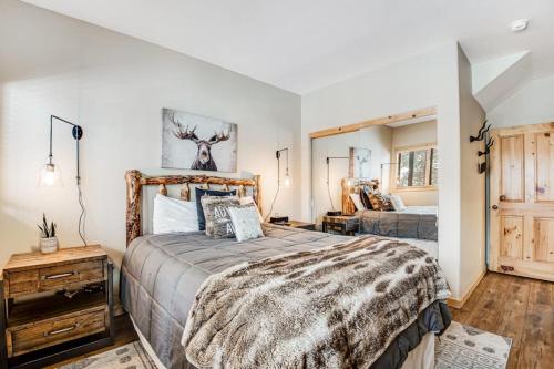 a bedroom with a large bed in a room at Take A Break In Breck in Breckenridge
