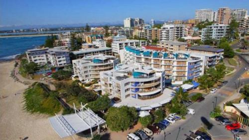 an aerial view of a city with a beach and buildings at Rolling Surf Resort Unit 48 in Caloundra