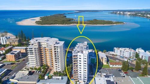 an aerial view of an island in a body of water at Grand Pacific Unit 104 in Caloundra