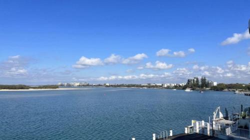 a large body of water with a city in the background at Pumicestone Chase Unit 5 in Caloundra