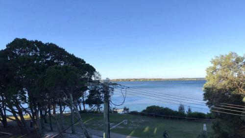 a view of a body of water with a pole at Sorrento Unit 5 in Golden Beach