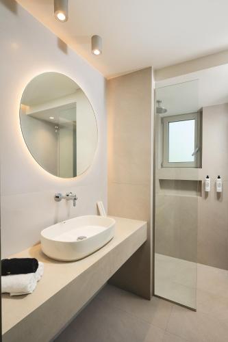 a bathroom with a sink and a mirror at Sal hotel Kissamos in Kissamos