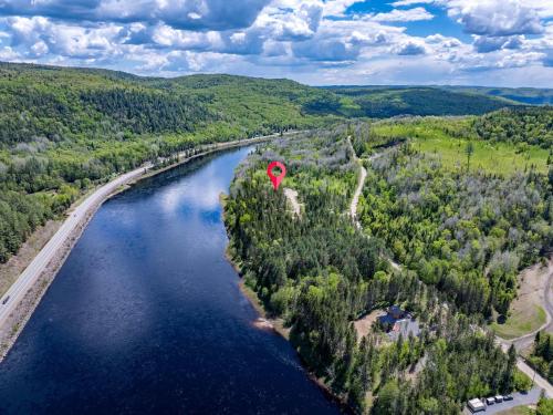 an aerial view of a river with a red marker at Spa & Riverside - Le Ptit Cool Des Bois in Trois Rives