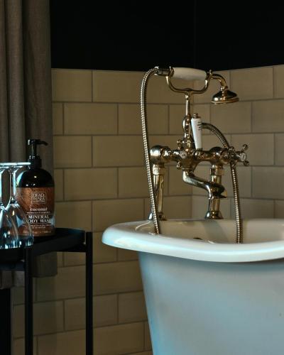 a bathroom sink with a faucet on top of it at The King's Head, Lanchester in Durham