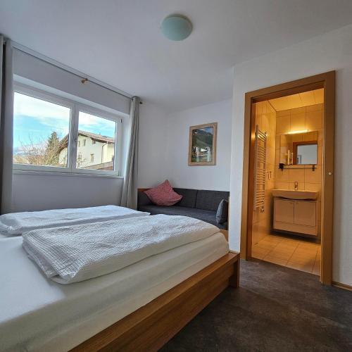 a bedroom with a large bed and a window at Apart Hannah in Uderns