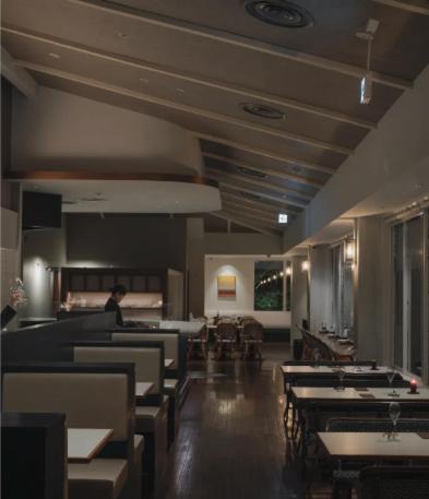 a dining room with tables and chairs in a restaurant at 森の宿 l ACAO FOREST 01 in Atami