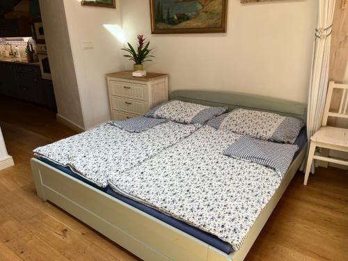 a bedroom with a bed and a table and a chair at Staré časy in Chotěboř