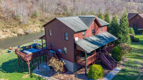an aerial view of a house with a wrap around deck at Riverbend Retreat in Todd