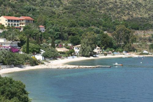 a small island in the middle of a body of water at Imerolia Studios in Kassiopi
