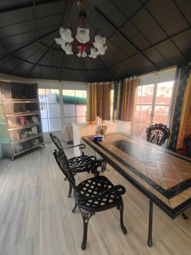 a dining room with a table and two chairs at 湖山沐旅 Hu Shan Mulu in Douliu