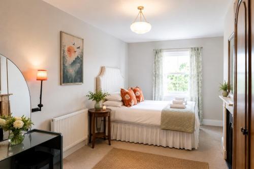 a bedroom with a bed and a window at Stylish Top Floor Retreat with Stunning Solent Views in Portsmouth