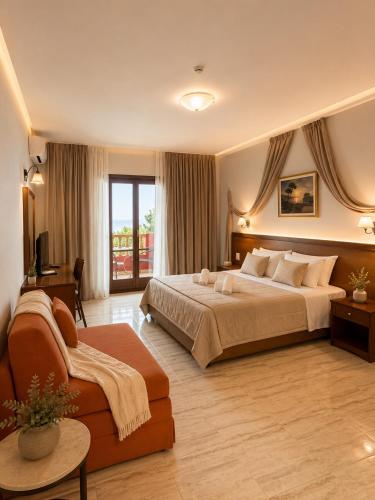 a large hotel room with a bed and a couch at Aristotelis in Ancient Epidauros