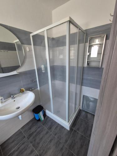 a bathroom with a shower and a sink at Piazza Salotto in Corigliano Calabro