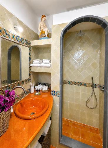 a bathroom with a sink and a shower at Casa Prete in Panarea