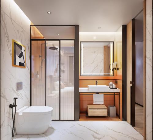a bathroom with a shower and a toilet and a sink at Ibis Bangkok Siam Ratchathewi in Bangkok