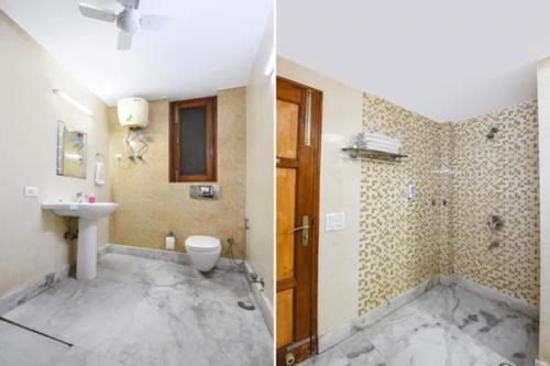 a bathroom with a toilet and a sink at FabHotel The Lalit Vibes - Nr DLF Phase 2 & MG Road Metro in Gurgaon