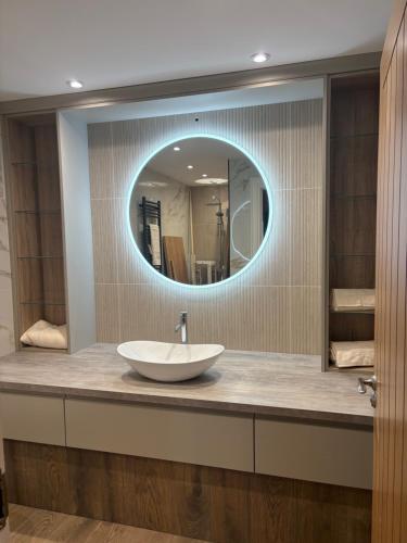 a bathroom with a sink and a mirror at The Old Bank in Warrenpoint
