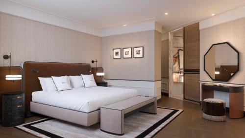 a bedroom with a bed and a large mirror at BLESS Barcelona - New Opening 2026 in Barcelona