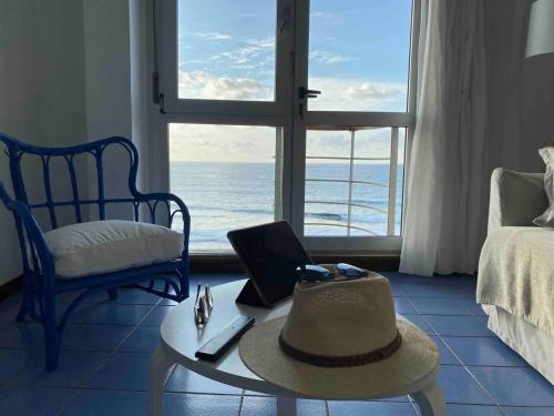 a room with a table with a laptop and a chair at Numancia 1 - 2A in Las Palmas de Gran Canaria