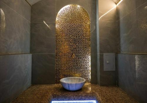 a bathroom with a large tub in a shower at Lavanda hotel Tashkent in Tashkent