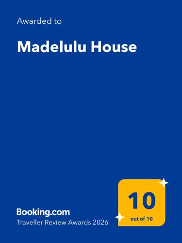 a screenshot of a cell phone with a yellow calculator house at Madelulu House in Pramanta