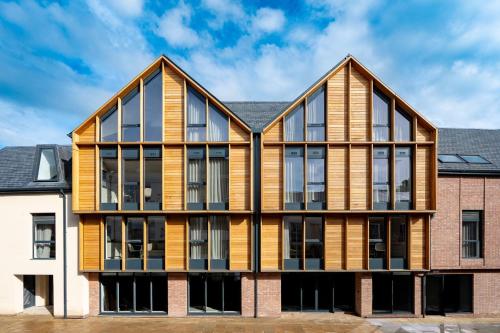 an exterior view of a building with large windows at Micklegate by Supercity Aparthotels in York