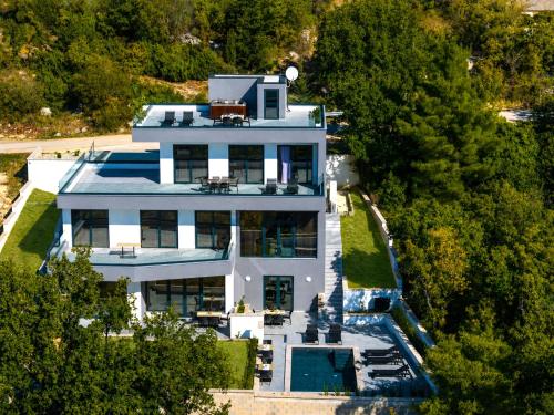 an aerial view of a house with a swimming pool at My Dalmatia - Sea View Villa Senti with private pool in Starigrad